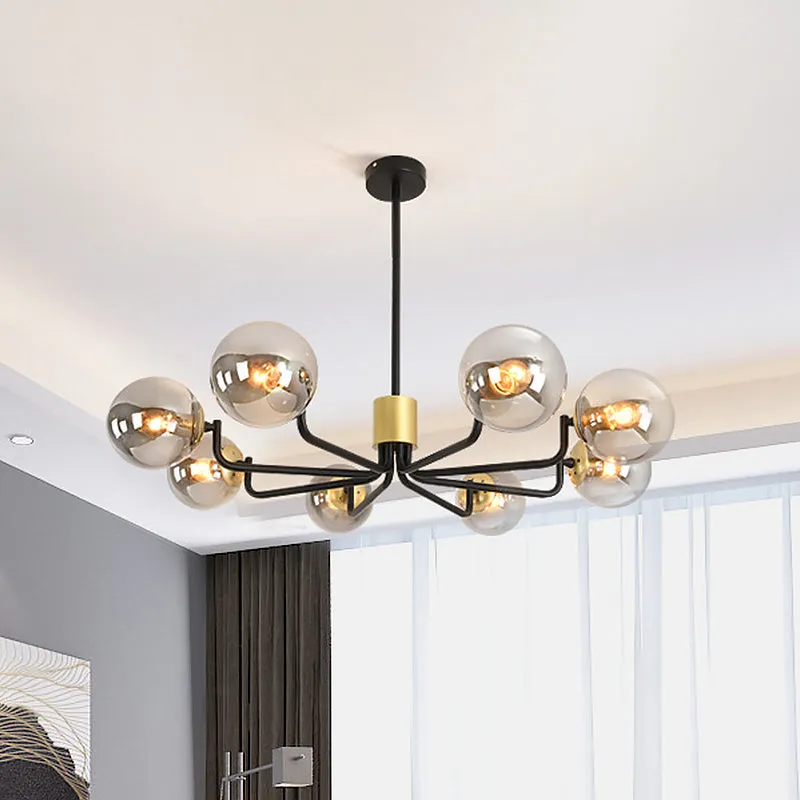 Modern 8-Head Brass and Black Chandelier with Grey Glass Spherical Suspension and Radial Design