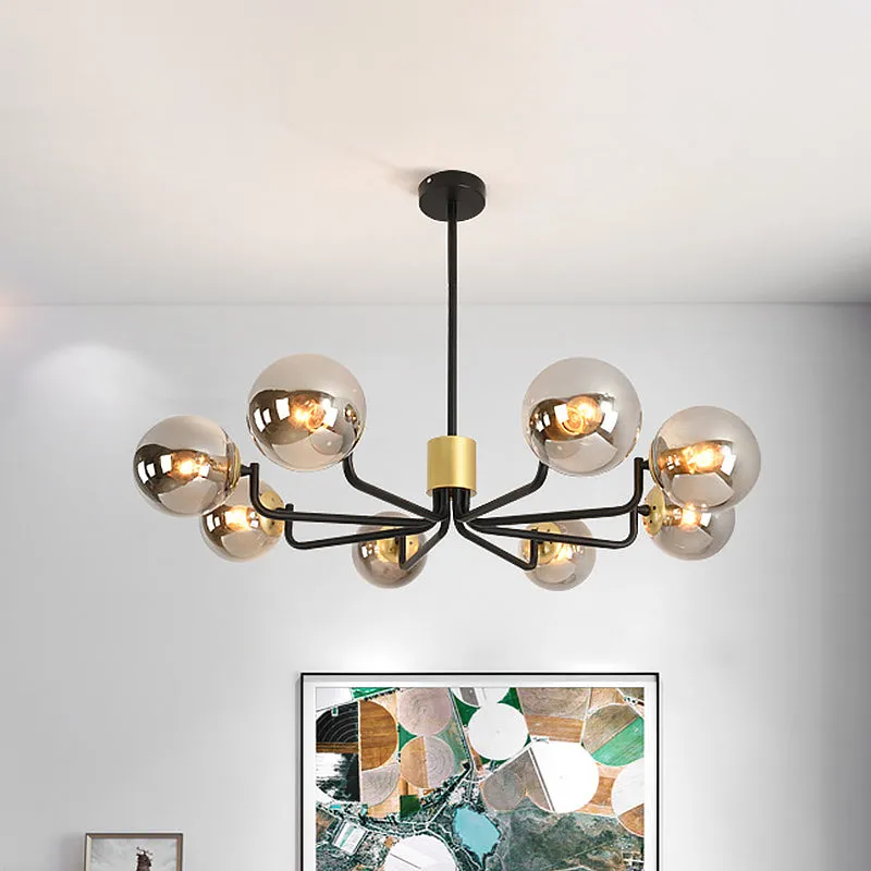 Modern 8-Head Brass and Black Chandelier with Grey Glass Spherical Suspension and Radial Design